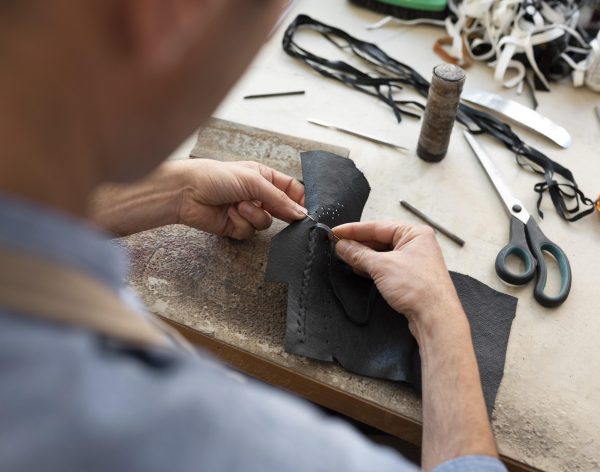 man-working-alone-leather-workshop